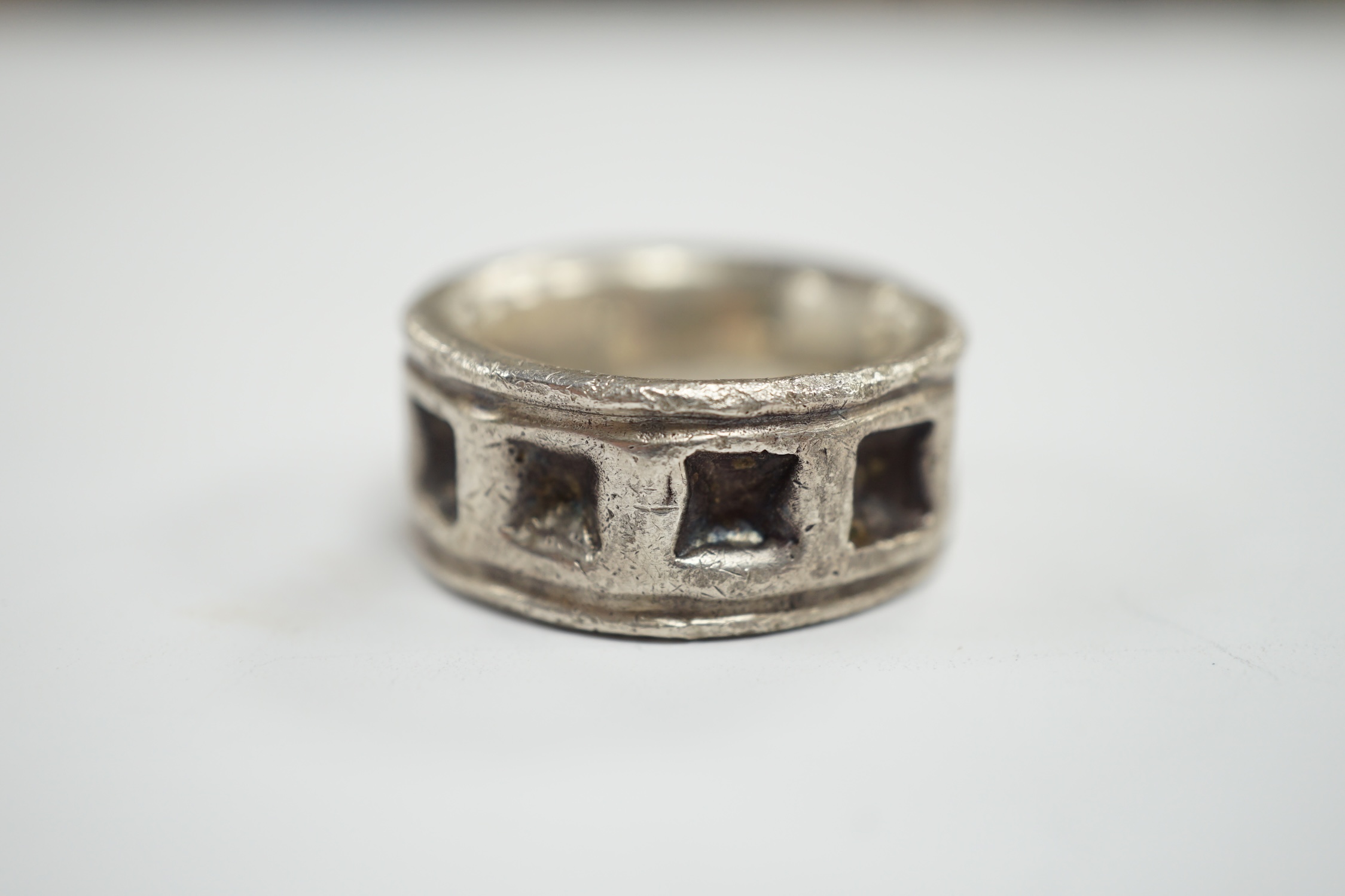 A carved heavy gauge white metal ring, thought to be of Viking origin?, size Q/R, 31.8 grams.